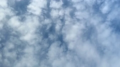 Blue sky with clouds floating away in time lapse on a summer morning Stock Footage 219771920