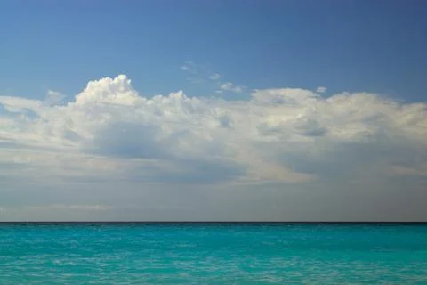 Blue sky with clouds over azure sea Stock Photos