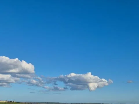 Blue sky with clouds over distant horizon Photos