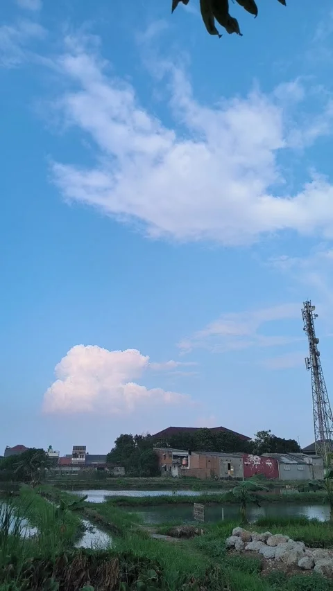 Blue Sky with Clouds Over Rural Landscape Stock Footage 312104805