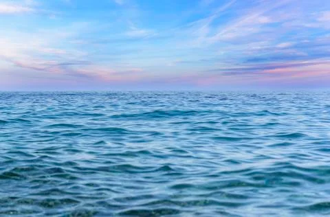 Blue sky with clouds over the sea. Stock Photos