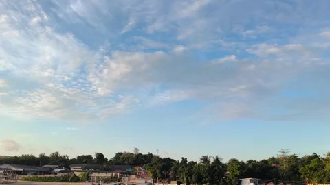 Blue Sky with Clouds Over Tropical Coastal Village Establishing Shot Video stock 340464858