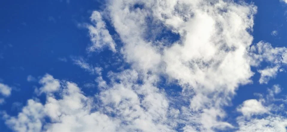 Blue sky with clouds Stock Photos