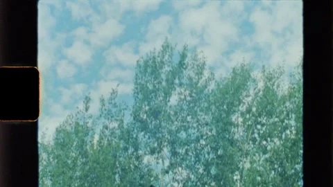 Blue sky with clouds. Shot on 8mm camera Stock Footage 259181227