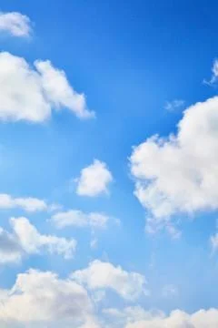 The blue sky with clouds. Spring, winter or summer heaven. Vivid background Stock Photos