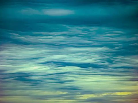 Blue sky with clouds at sunset Stock Photos