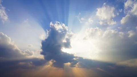 Blue sky in the clouds. sunset sky, yellow white rays Stock Photos