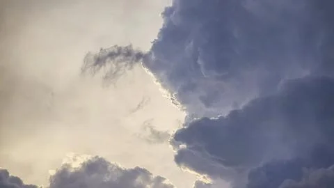 Blue sky with clouds, thunderclouds, summer weather. Sunset. White clouds. Фото