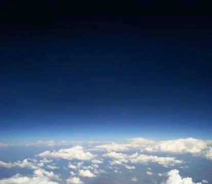 Blue sky with clouds. The view from the top. Stock Photos