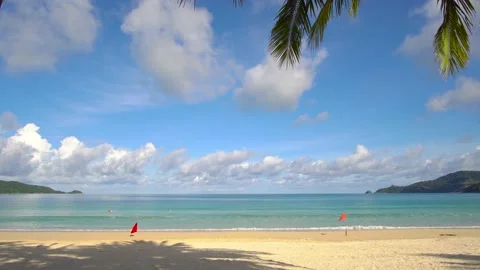 Blue sky with clouds with waves rolling onto an island beach Видео 139144771