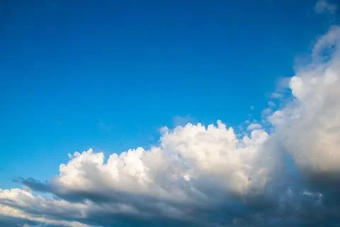 Blue sky cloudscape and white clouds background with sunbreams Stock Photos
