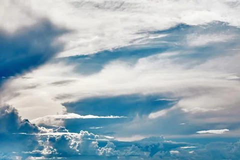 Blue sky covered with white clouds. Beautiful background for design Stock Photos
