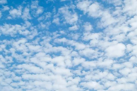 Blue sky with cumulus clouds at daytime. Natural panoramic background photo t Stock Photos