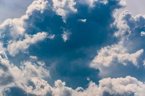 Blue sky with cumulus clouds during summer day Stock Photos