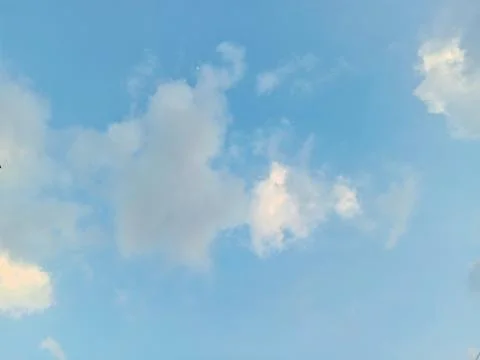 Blue sky with cumulus clouds or fluffy white clouds. Stock Photos