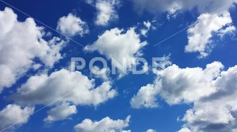 Blue sky with cumulus clouds Stock Photos