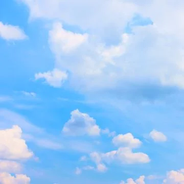 Blue sky with cumulus clouds Stock Photos