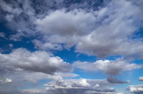 Blue sky, Cumulus clouds Stock Photos