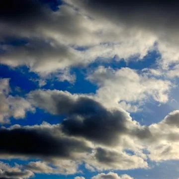 The blue sky with dark clouds Stock Photos