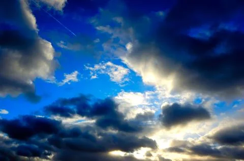 The blue sky with dark clouds Stock Photos