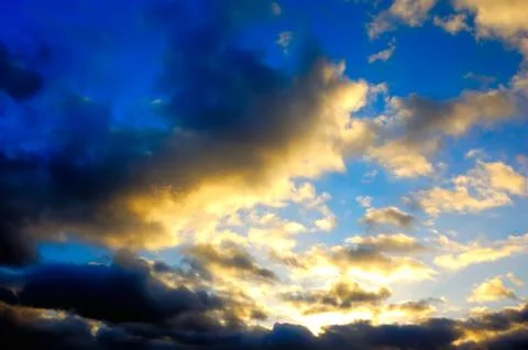 The blue sky with dark clouds Stock Photos