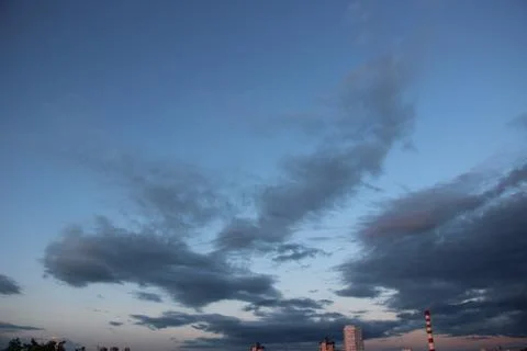 Blue sky with dark clouds in sunset after the rain Stockfoto's