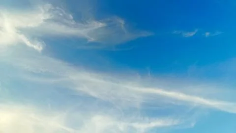 The blue sky is decorated with dense clouds that spread out on a sunny day... Stock Photos