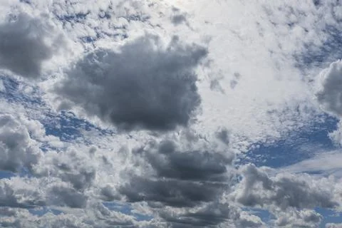 Blue sky with different types of clouds at different altitudes Stock Photos