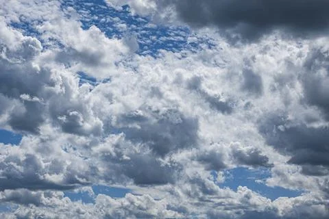 Blue sky with different types of clouds at different altitudes Stock Photos