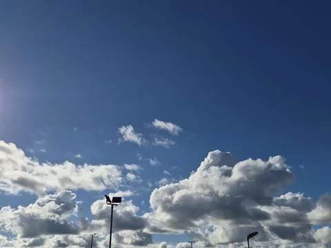 Blue Sky with Dramatic Clouds and Streetlights Stock Photos