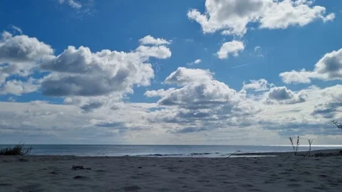 Blue Sky with Dramatic White Clouds over Calm Sea 4K Video stock 319008901