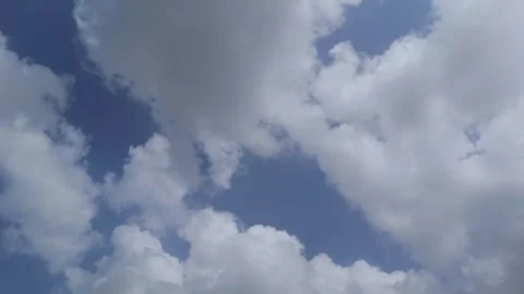 Blue Sky with Dramatic White Clouds Moving Across the Atmosphere Time Lapse Stock Footage 337959395