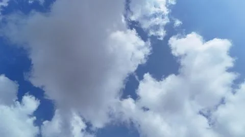 Blue Sky with Dramatic White Clouds Captured from Drone Stock Photos