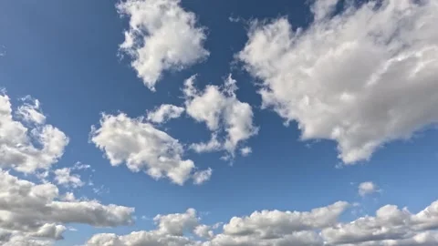 Blue sky during the day with beautiful, textured nomadic clouds. Time-lapse m Stock Footage 306010497