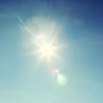 Blue sky during a sunny day with sunlight. Stock Photos