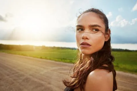 Blue sky, exercise and running with woman in countryside for commitment to .. Stock Photos