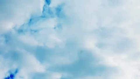 Blue sky with fast moving white cumulus clouds timelapse Stock Footage 332047148