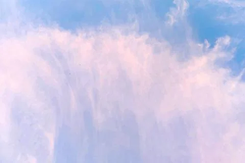 Blue sky with feather clouds. Beautiful natural background. Stock Photos