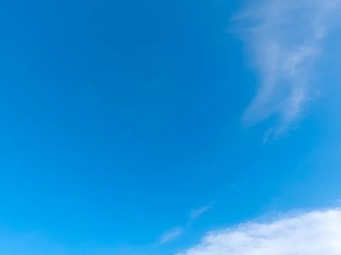 Blue sky with a few white clouds Stock Photos
