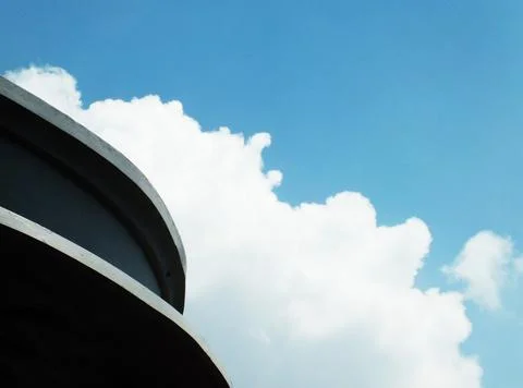A blue sky with a few white clouds 스톡 사진