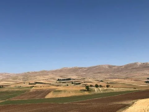 Blue Sky with Fields, Mountains Foto stock