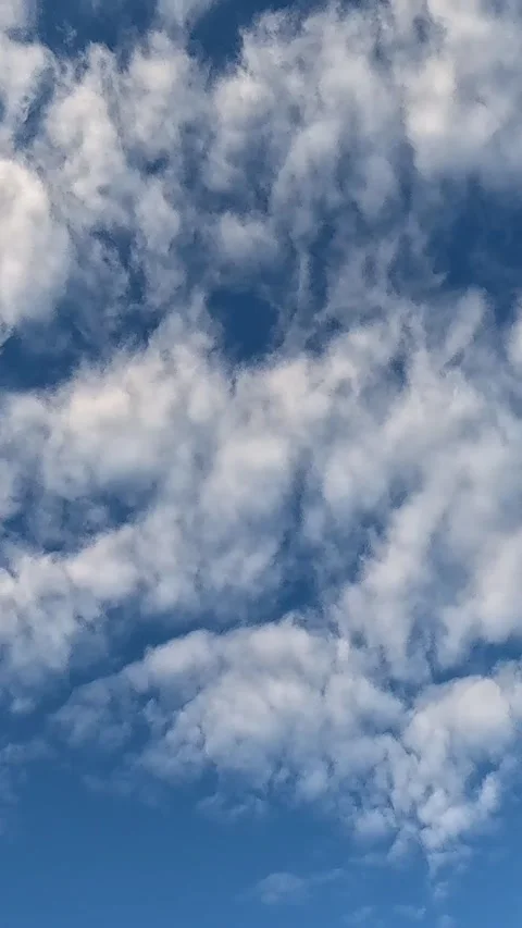 Blue sky filled with dense fluffy cumulus clouds. timelapse Stock Footage 318216408