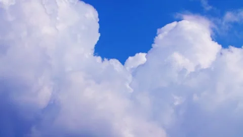 Blue sky filled with soft white clouds on a bright clear day (timelaps) Stock Footage 331367170