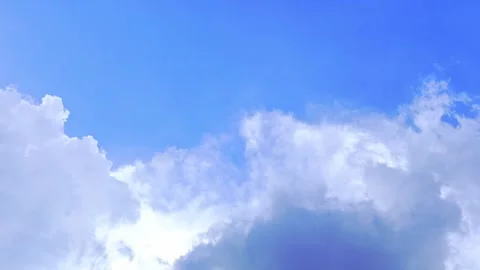 Blue sky filled with soft white clouds Vídeo Stock 335430522
