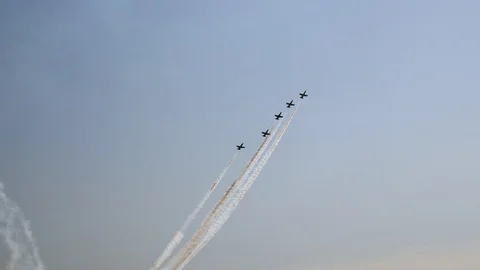 Blue sky Five planes fly upward Diverging to the sides Leave a mark Video stock 120175535