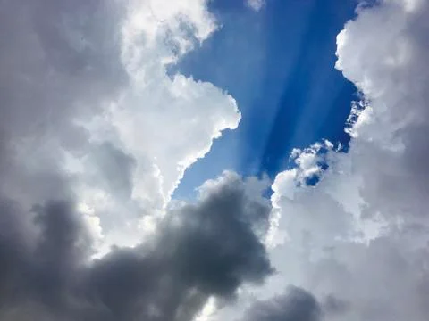 Blue sky with fluffy cloud Stock Photos