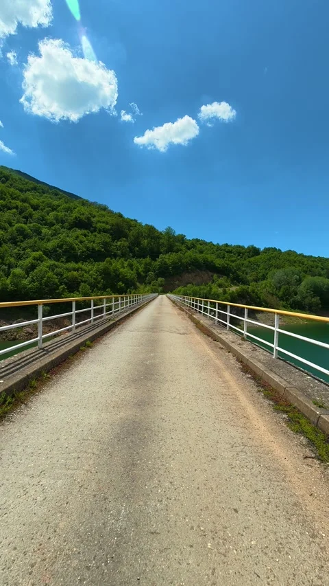 Blue sky, fluffy clouds above green hills. Zavoj Lake, Serbia. Vertical Vídeo Stock 337495680