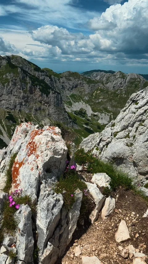 Blue sky with fluffy clouds above peaks. Savin Kuk peak Montenegro, Vertical Stock Footage 343573770