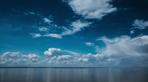 Blue Sky Fluffy Clouds over Sea Timelapse 4K Stock Footage