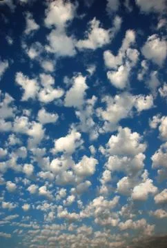 Blue sky with fluffy clouds Stock Photos